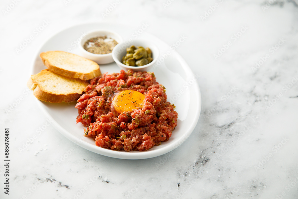 Traditional steak tartare with egg yolk Traditional steak tartare with egg yolk