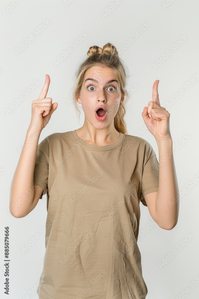 Surprised woman pointing up Surprised woman pointing up