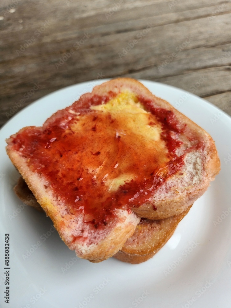 Slice toast bread with strawberry jam and butter Slice toast bread with strawberry jam and butter