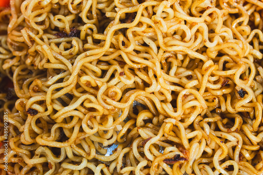 Fried noodles that are ready to be eaten in an orange plate, instant food, instant noodles, asian food, spicy. Fried noodles that are ready to be eaten in an orange plate, instant food, instant noodles, asian food, spicy.
