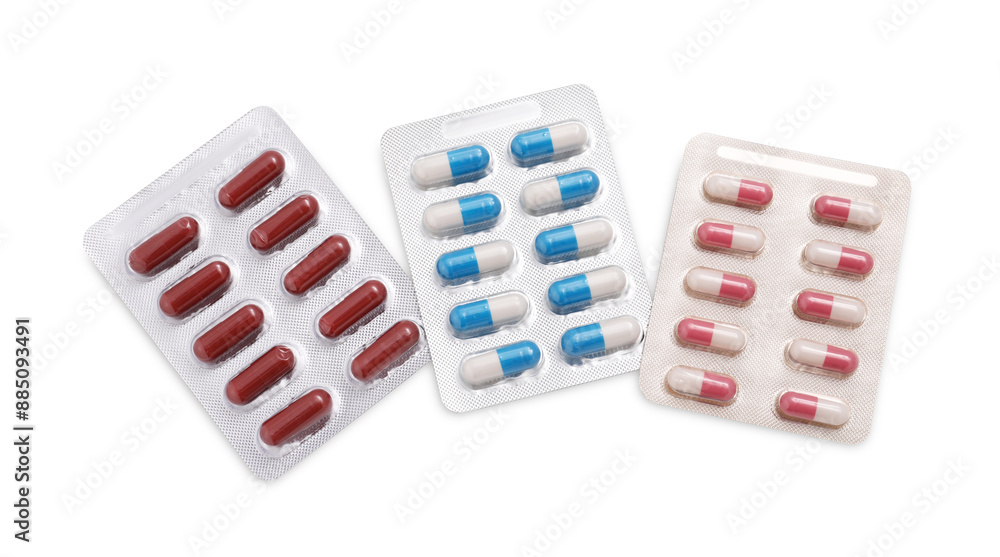 Different antibiotic pills isolated white, top view