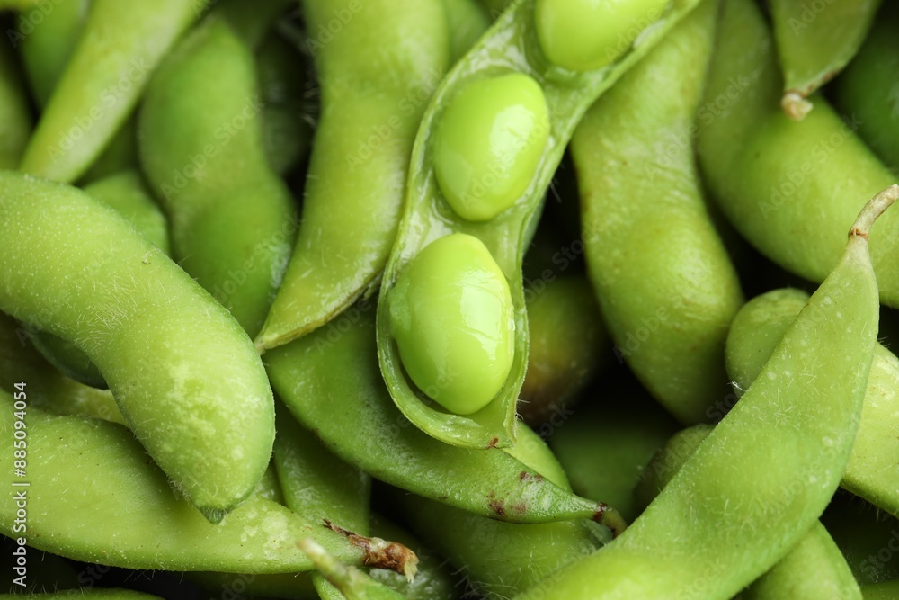 Fresh edamame pods with soybeans as background, closeup Fresh edamame pods with soybeans as background, closeup