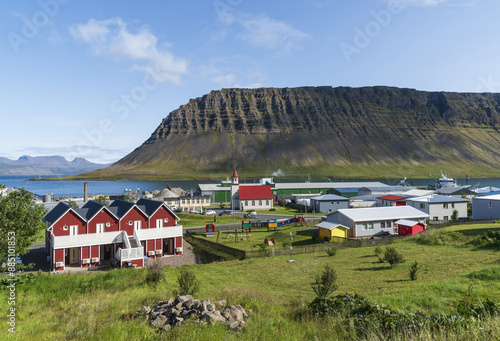 Ólafsvík, Iceland - July 29, 2023: High angle and summer view of houses and a school with playground on the hill against sea at a small village
 photo