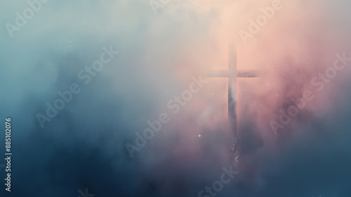 A blurry image of a cross with a blue sky background