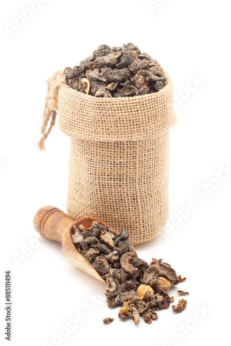 Close-up of dry Organic gooseberry (Phyllanthus emblica) or Amla fruits, in a jute bag and on a scoop, Isolated on a white background. photo