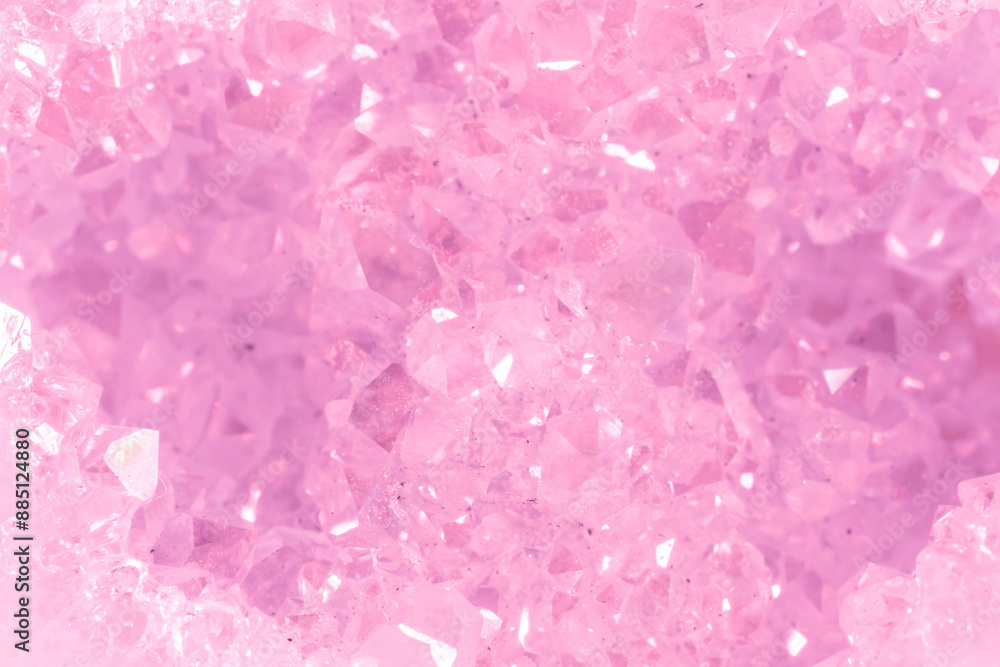 Amethyst pink crystals. Gems. Mineral crystals in the natural environment. Texture of precious and semiprecious stones. Seamless background with copy space colored shiny surface of precious stones. Amethyst pink crystals. Gems. Mineral crystals in the natural environment. Texture of precious and semiprecious stones. Seamless background with copy space colored shiny surface of precious stones.