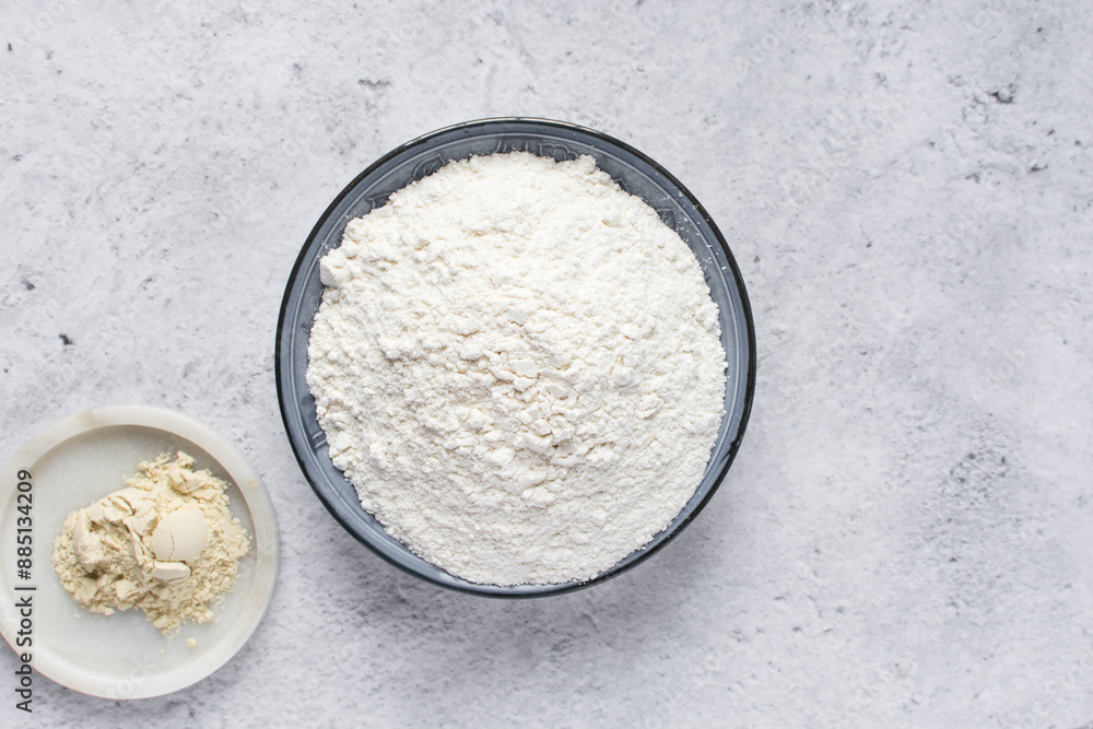 All purpose flour and vital wheat gluten in a ceramic bowl, process of making bread flour All purpose flour and vital wheat gluten in a ceramic bowl, process of making bread flour