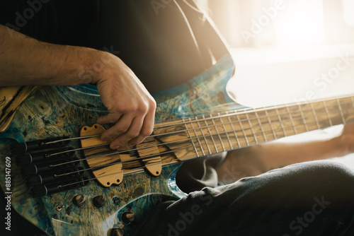 Close-up of Musician Playing Electric Bass Guitar.