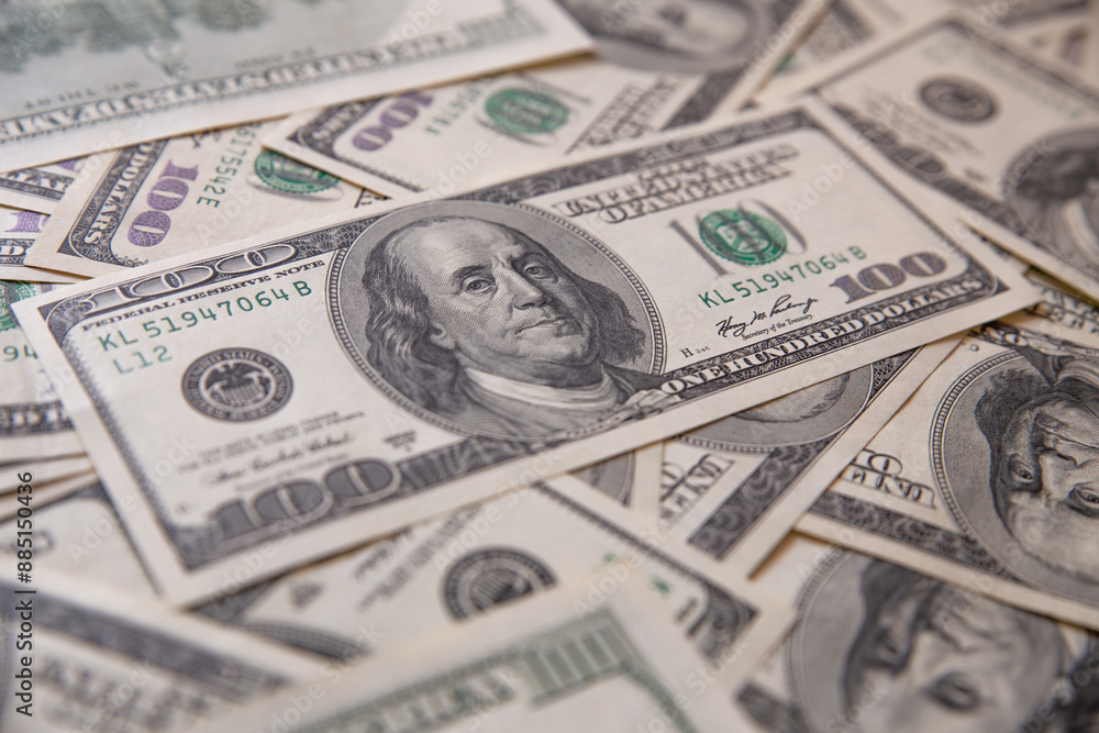 Background of one hundred dollar bills. Close-up. Top view. Background of one hundred dollar bills. Close-up. Top view.