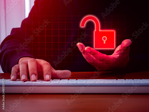 Cyberattack, cybercrime and internet crime, scam, hacking concepts. Unsecure, Unlocked padlock icon, in anonymous hackers hands on red square digital grid while typing on keyboard, laptop computer. photo