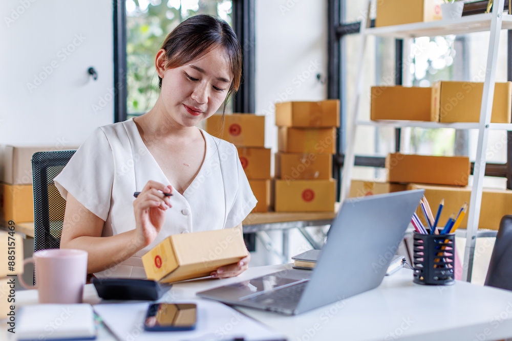 Portrait business woman smile and use tablet checking information on parcel shipping box before send to customer. Entrepreneur small business working at home. SME business online marketing.
Portrait business woman smile and use tablet checking information on parcel shipping box before send to customer. Entrepreneur small business working at home. SME business online marketing.