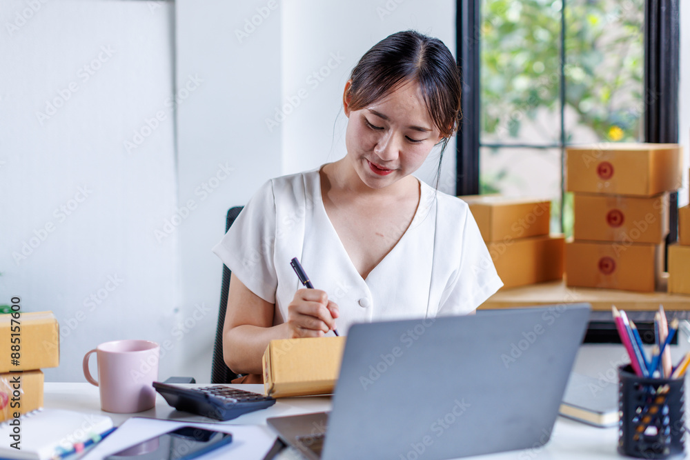 Portrait business woman smile and use tablet checking information on parcel shipping box before send to customer. Entrepreneur small business working at home. SME business online marketing.
Portrait business woman smile and use tablet checking information on parcel shipping box before send to customer. Entrepreneur small business working at home. SME business online marketing.