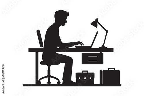 a man working on a laptop at a desk silhouette