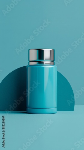 A blue container with a silver lid sits on a blue background