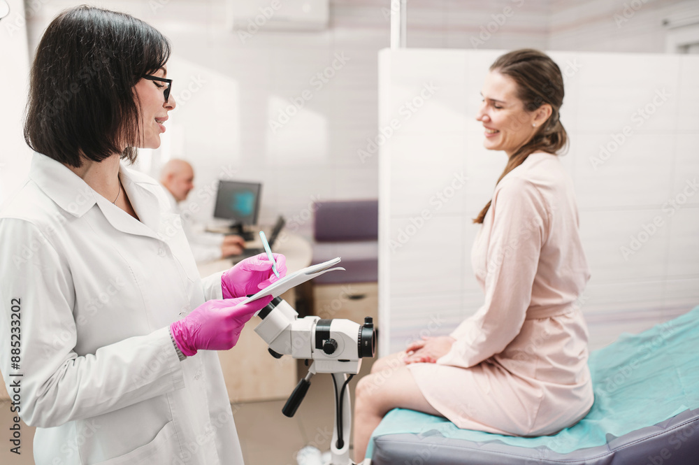 woman doctor look microscope at gynecologist's appointment. Female gynecologist examining patient on chair with equipment. Colcoscopy and Pap test woman doctor look microscope at gynecologist's appointment. Female gynecologist examining patient on chair with equipment. Colcoscopy and Pap test