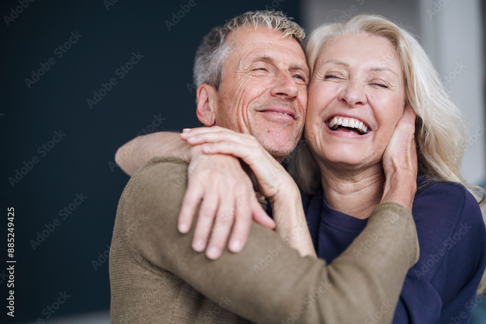 Happy retired senior couple hugging each other Happy retired senior couple hugging each other