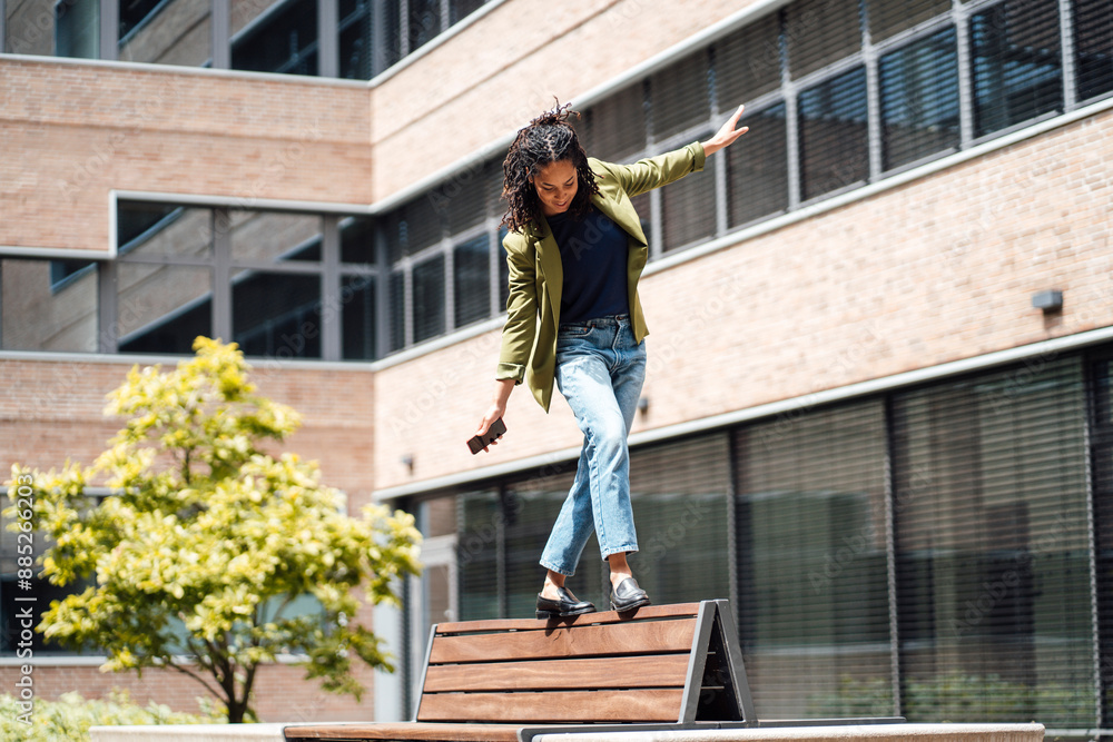 custom made wallpaper toronto digitalYoung businesswoman balancing and walking on bench at office park