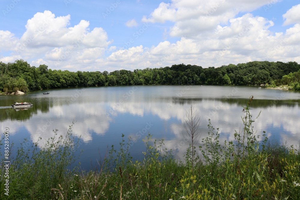 The peaceful lake in the countryside on a cloudy sunny day. The peaceful lake in the countryside on a cloudy sunny day.