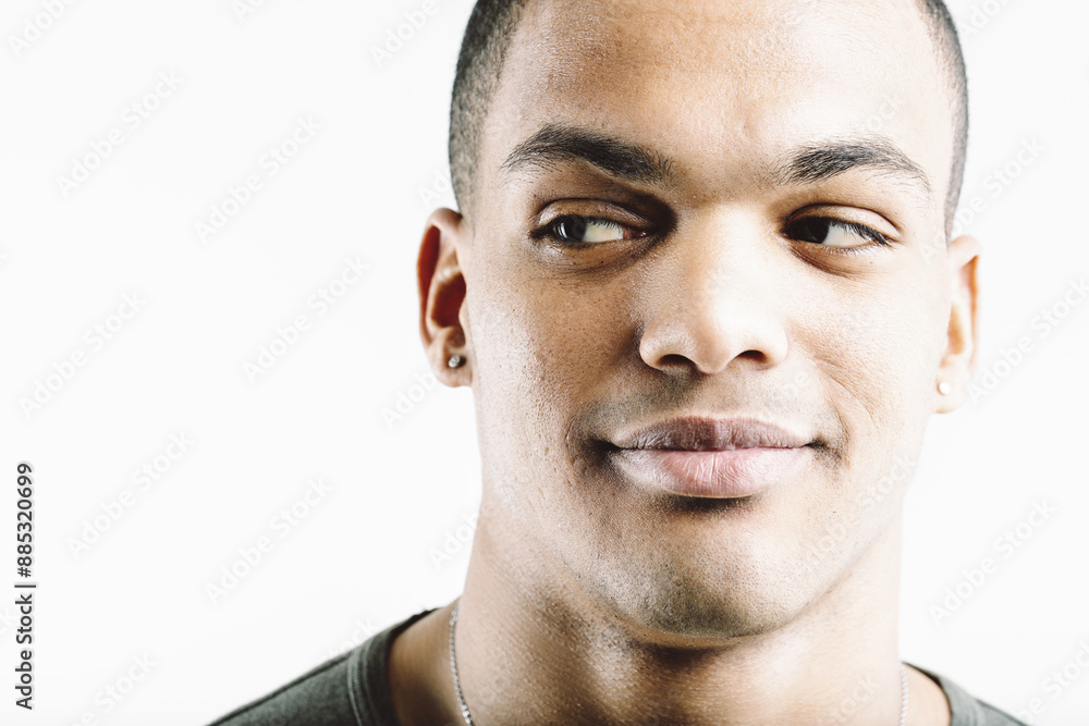 Fototapeta premium Green-shirted man, playful, curious sideways glance