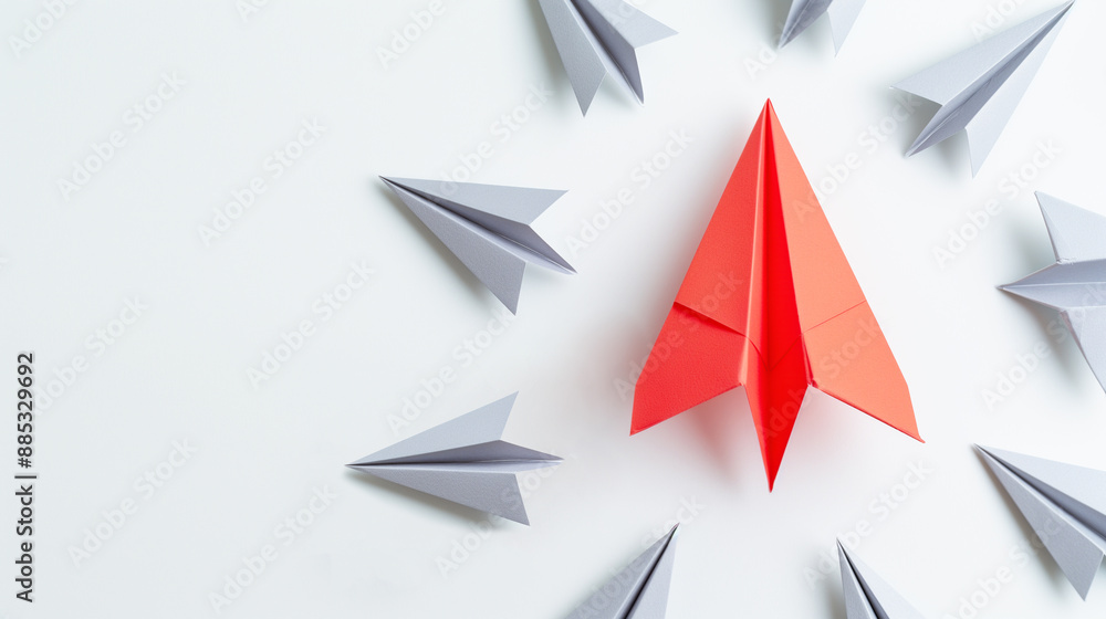 Red paper plane taking different path amid grey planes. Business ideas and leadership creative thinking concept. Think different. Innovation and solution concept. Copy space. Red paper plane taking different path amid grey planes. Business ideas and leadership creative thinking concept. Think different. Innovation and solution concept. Copy space.