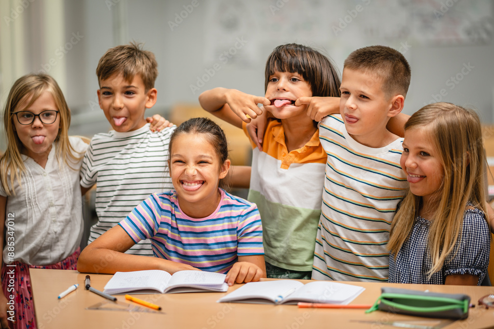 Portrait of group young students climb and have fun in the classroom Portrait of group young students climb and have fun in the classroom