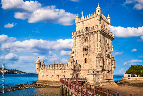 Belem tower and bridge, Lisbon, Portugal at blue day sky with clouds