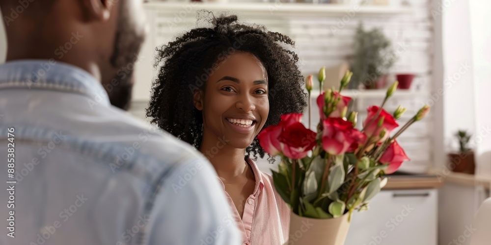 Valentine's Day surprise: couple, hug, and flowers with love bouquet, relationship, anniversary, or behind. In home, man and woman embrace with roses for marriage, date, celebration, or gift. Valentine's Day surprise: couple, hug, and flowers with love bouquet, relationship, anniversary, or behind. In home, man and woman embrace with roses for marriage, date, celebration, or gift.