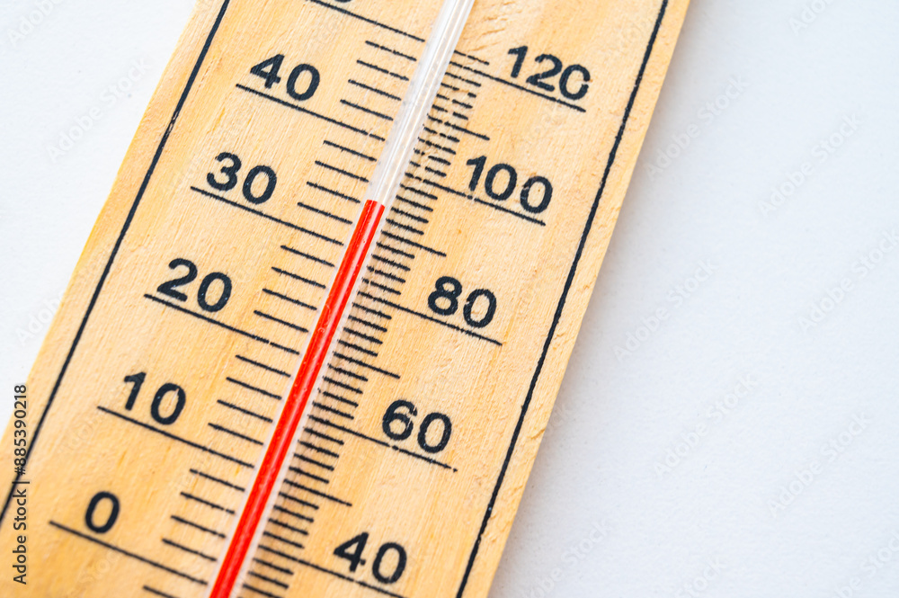 Thermometer on a light surface, indicating high temperature. Global warming.
Thermometer on a light surface, indicating high temperature. Global warming.