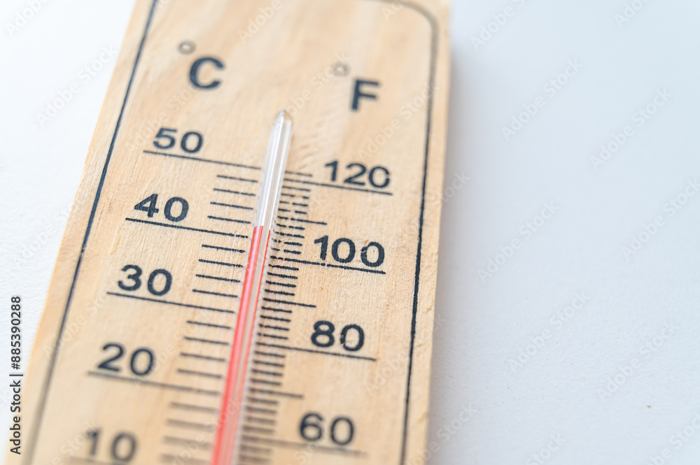 Thermometer on a light surface, indicating high temperature. Global warming.
Thermometer on a light surface, indicating high temperature. Global warming.