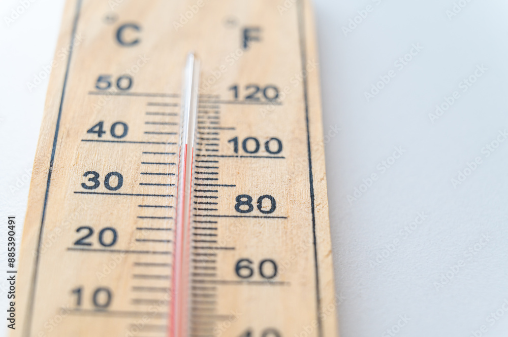 Thermometer on a light surface, indicating high temperature. Global warming.
Thermometer on a light surface, indicating high temperature. Global warming.