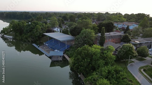 Aerial over Craig Swayze Memorial Grandstand and Martindale Pond in Port Dalhousie, St. Catharines, Ontario, Canada during a hazy sunset in July, 2024. photo