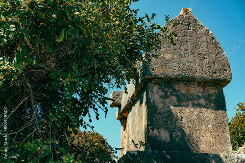 lycian stone tombs, tlos ancient town in kas antalya , turkey, sarcophagus-shaped tomb, only known from Lycia photo