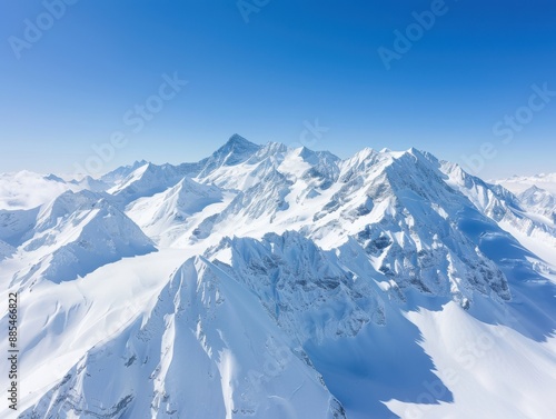 Snow-capped mountains under clear blue sky, panoramic view, high angle, pristine and untouched, crisp and cold atmosphere, rugged landscape