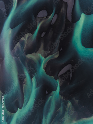 Obraz na płótnie View from above, stunning patterns created in the volcanic sands of Iceland. As glaciers melt the water flows as rivers out to sea. Natural pattern, background, wallpaper. w salonie