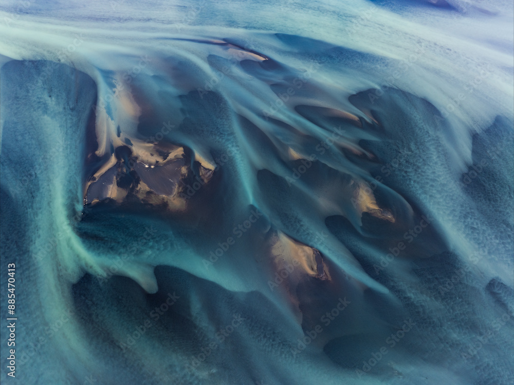 View from above, stunning patterns created in the volcanic sands of Iceland. As glaciers melt the water flows as rivers out to sea. Natural pattern, background, wallpaper.