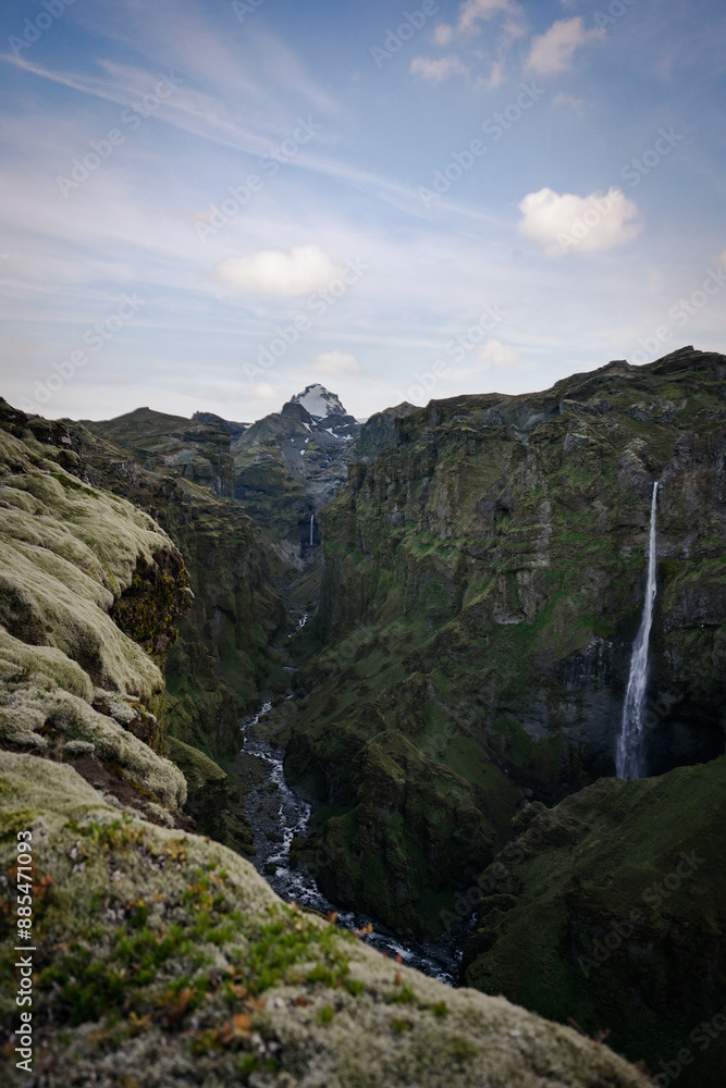View from above, stunning aerial view of a dramatic landscape with a beautiful waterfall, Hangandifoss, Iceland. View from above, stunning aerial view of a dramatic landscape with a beautiful waterfall, Hangandifoss, Iceland.