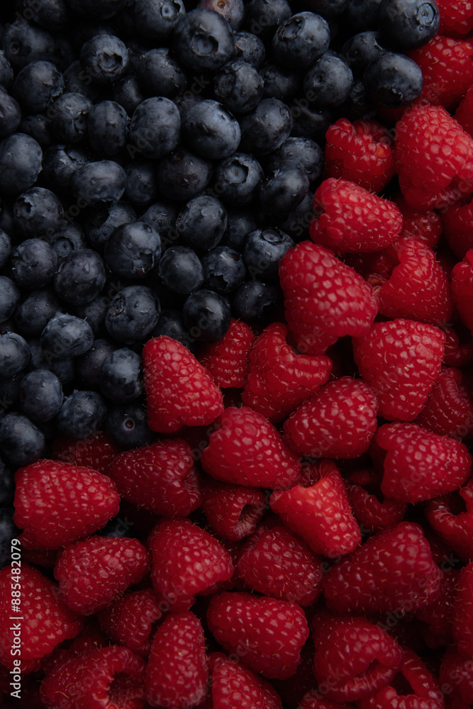Blueberries and raspberries as a background. Top view. Blueberries and raspberries as a background. Top view.