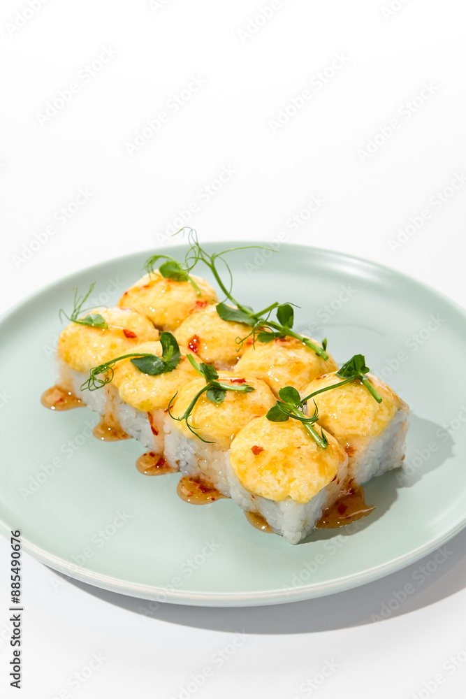 Baked Cheese Sushi Roll with Sweet Chili Sauce on a Light Green Plate Baked Cheese Sushi Roll with Sweet Chili Sauce on a Light Green Plate