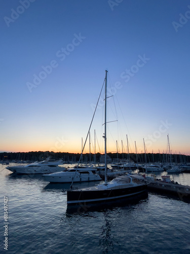 a boat is docked at a marina at sunset