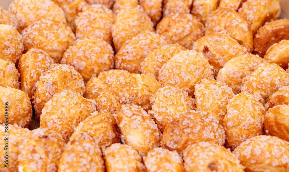 Puff pastries, round sugar-coated sugar puffs, golden crispy baked sweets, traditional French patisserie, biscuits Puff pastries, round sugar-coated sugar puffs, golden crispy baked sweets, traditional French patisserie, biscuits