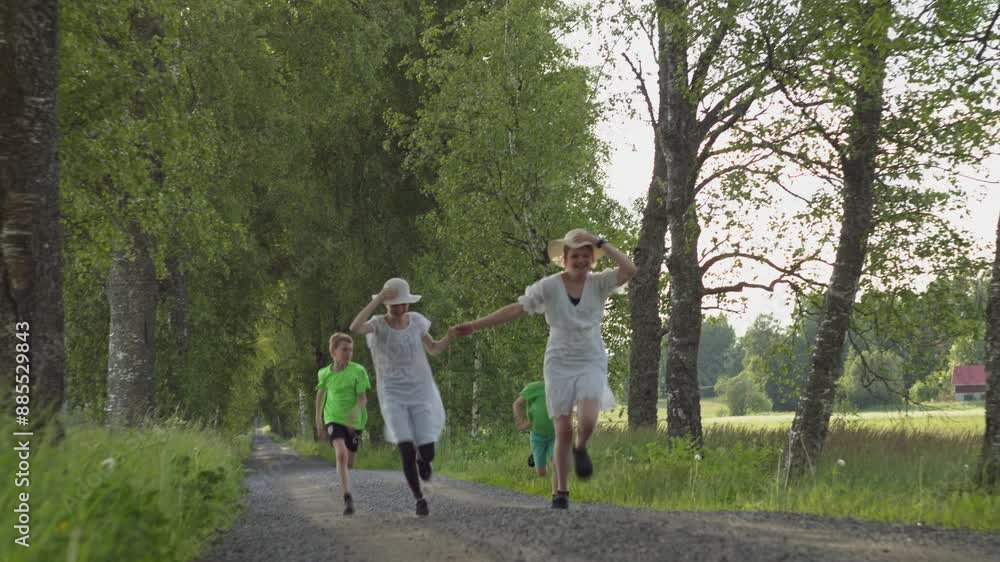 family walking in park. children running down the road. happy family concept family walking in park. children running down the road. happy family concept