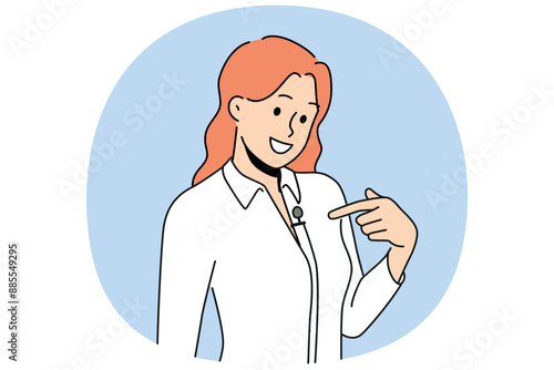 Woman with lavalier microphone on shirt smiles as she prepares for television interview. Girl with microphone for conducting business training and providing high-quality sound at corporate event