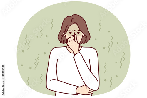 Woman closes nose in disgust at smell and toxic aroma caused by violation of hygiene rules. Young girl in white sweater feels stink and bad smell of clothes or socks in need of washing