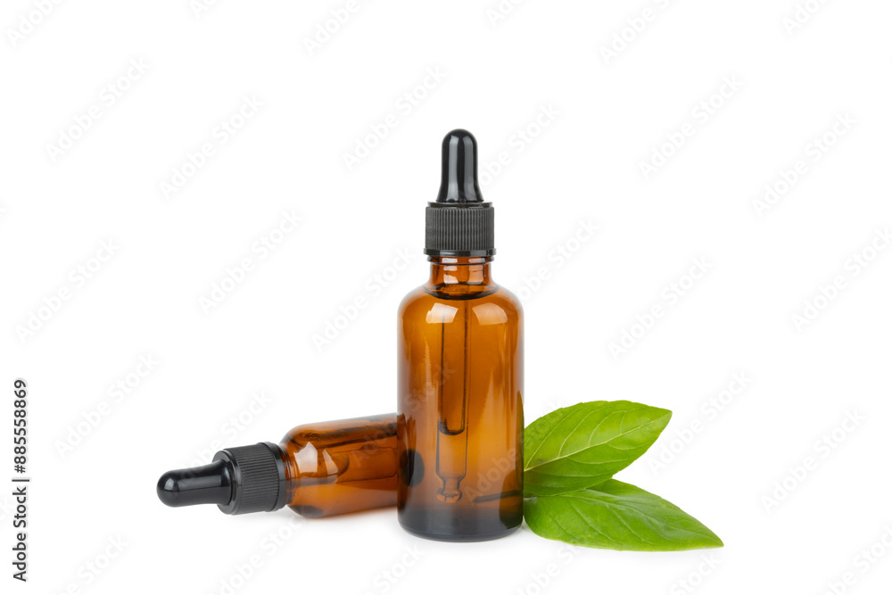 Basil essential oil isolated on white background. Basil essential oil and fresh leaves. Aromatherapy. Aroma oil. Medical herbs. Alternative medicine. Place for text. Copy space. Basil essential oil isolated on white background. Basil essential oil and fresh leaves. Aromatherapy. Aroma oil. Medical herbs. Alternative medicine. Place for text. Copy space.