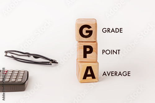 Obraz na płótnie Three wooden blocks with text GPA symbolizing the concept of Grade point Average
