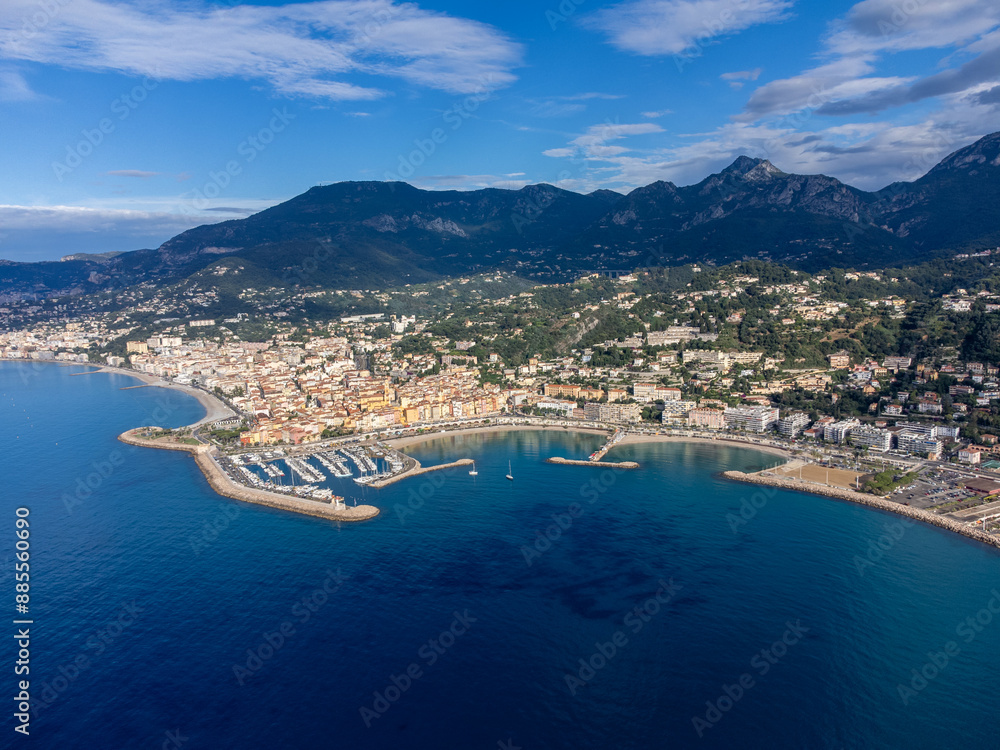 Naklejka premium Aerial view on French Riviera, colorful Menton old city and marina on Mediterranean Sea near French-Italian border, travel destination, panoramic view from above