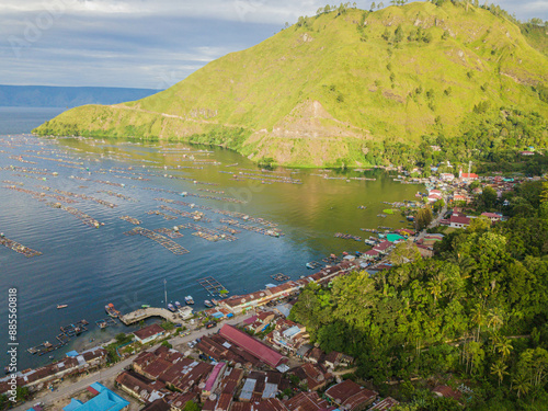 Aerial drone view of small town by  Toba Lake side at Haranggaol in Simalungun, Sumatra Utara, Indonesia photo