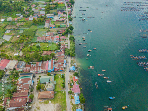 Aerial drone view of small town by  Toba Lake side at Haranggaol in Simalungun, Sumatra Utara, Indonesia photo