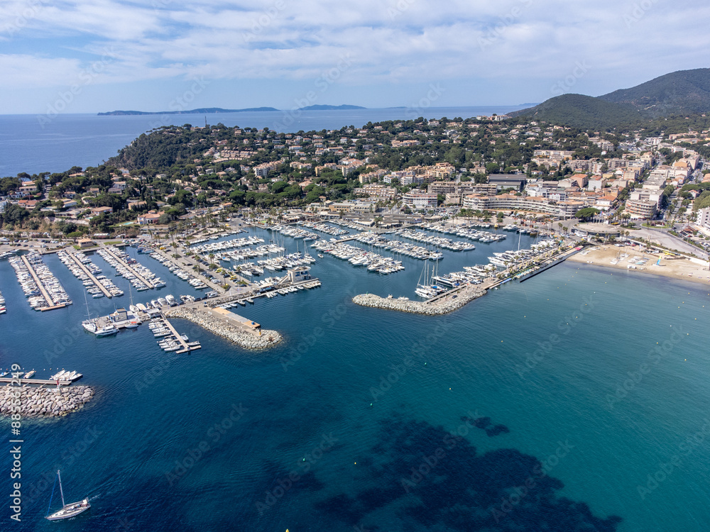 Fototapeta premium Aerial view on yacht boats, crystal clear blue water of white sandy beach near Cavalaire-sur-Mer, summer vacation on French Riviera, Var, France
