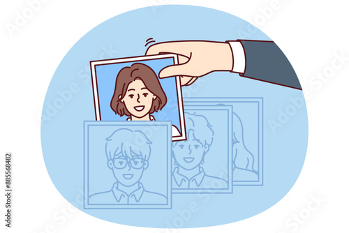 Hand of recruiter making selection of employees for company assembling team in HR division corporation. Person is engaged in recruitment, working as HR manager and finding people for current vacancies